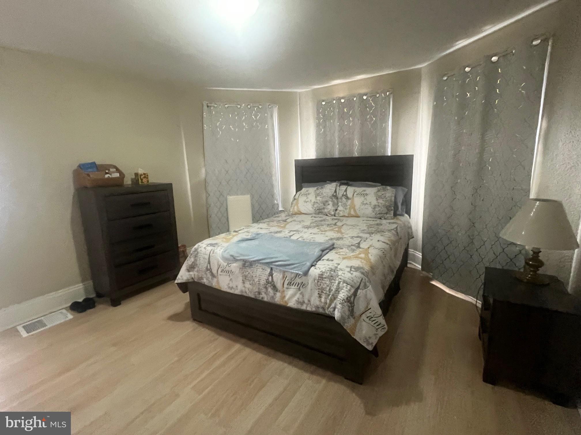 810 North Division Street Salisbury, MD 21801 - Photo 12 of 38 a bedroom with a bed and a closet