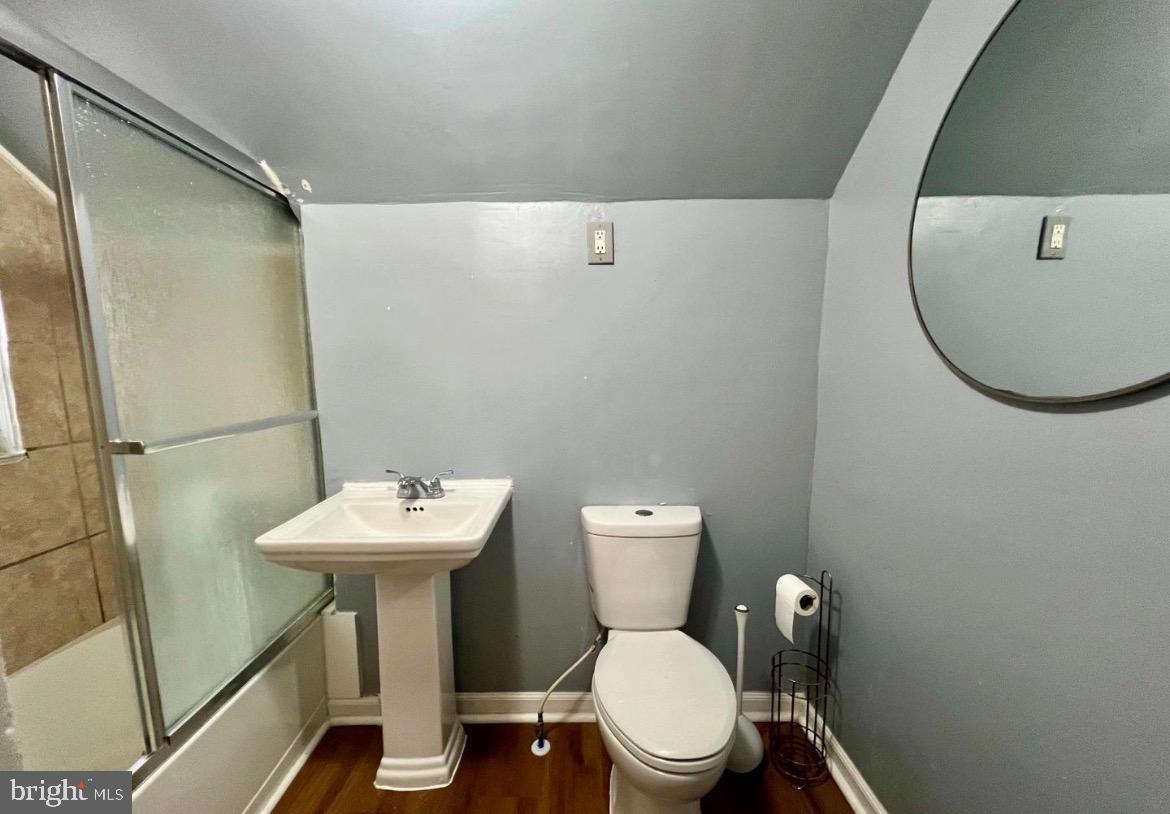 810 North Division Street Salisbury, MD 21801 - Photo 25 of 38 a bathroom with a toilet a sink and mirror