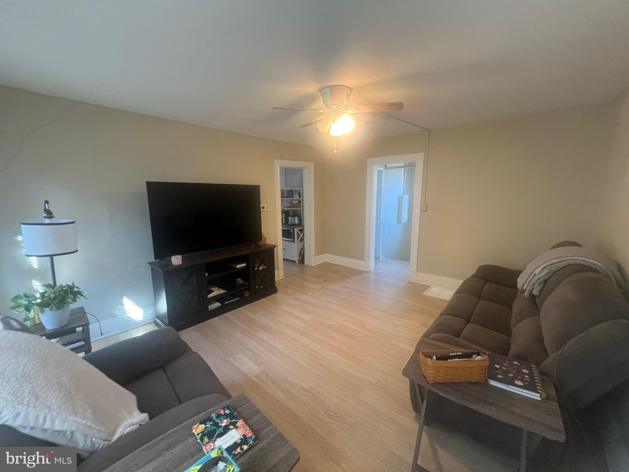 810 North Division Street Salisbury, MD 21801 - Photo 5 of 38 a living room with furniture and a flat screen tv