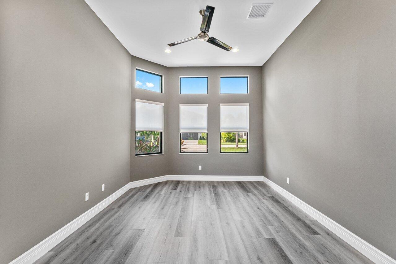 17352 Rosella Road Boca Raton, FL 33496 - Photo 15 of 41 a view of room with window ceiling fan and hardwood floor