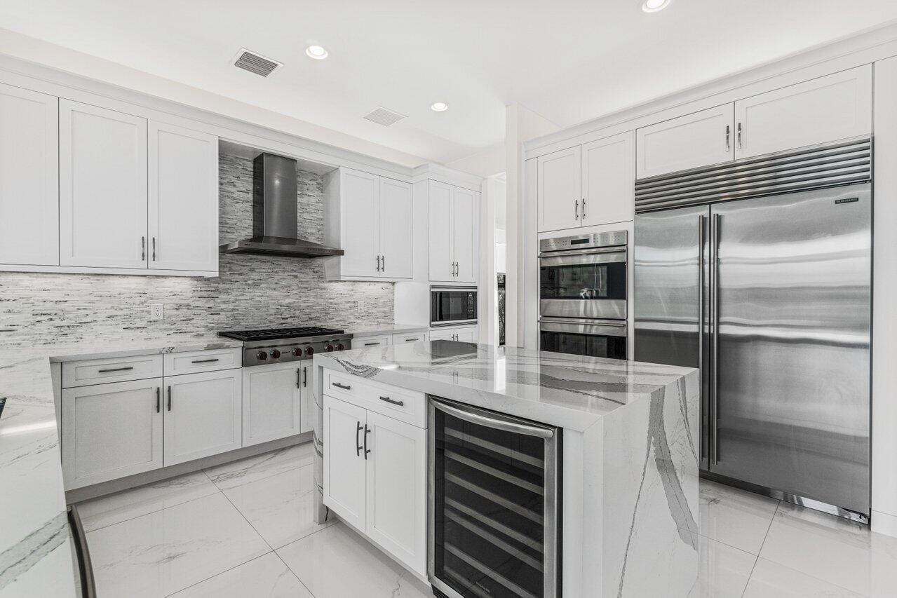 17352 Rosella Road Boca Raton, FL 33496 - Photo 7 of 41 a kitchen with cabinets stainless steel appliances and a counter space