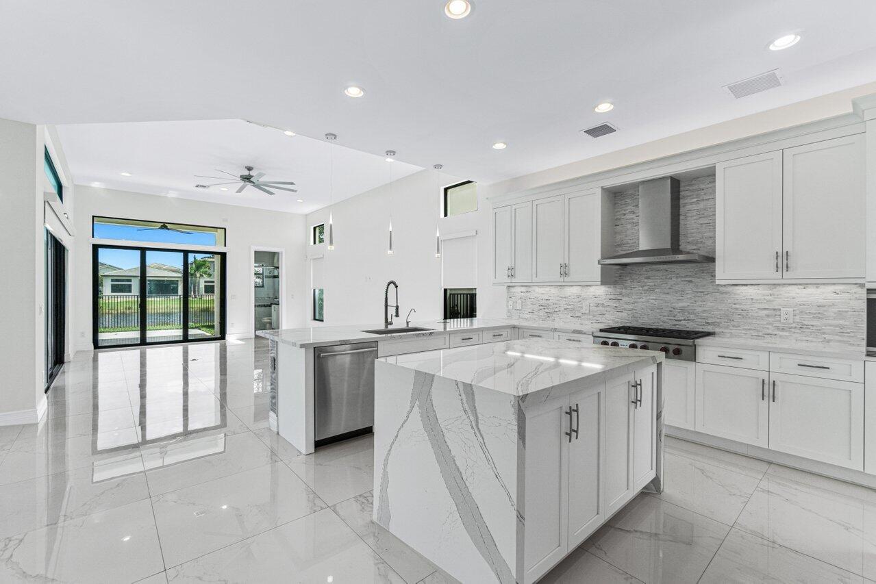 17352 Rosella Road Boca Raton, FL 33496 - Photo 10 of 41 a kitchen with a stove top oven sink and cabinets