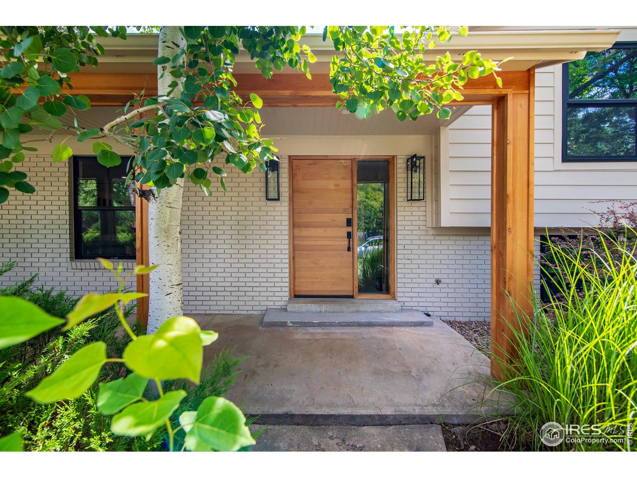 290 Mohawk Drive Boulder, CO 80303 - Photo 2 of 6 a front view of a house with a yard