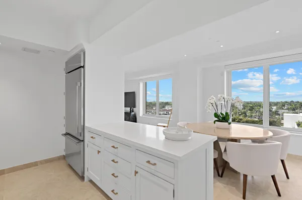 a room with a table chairs and wooden floor