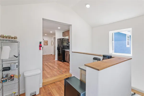 a view of a kitchen cabinets and refrigerator