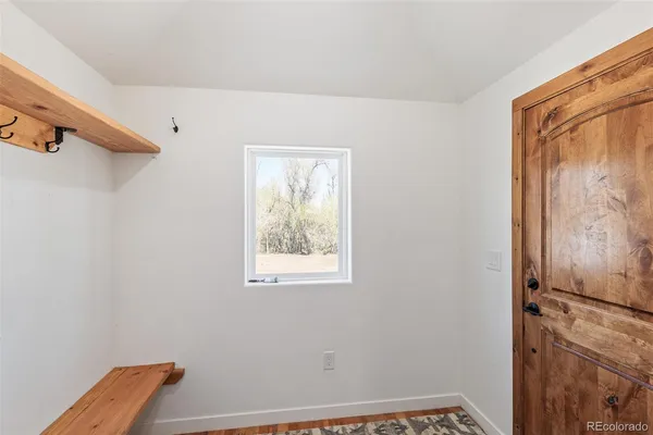 a view of room with window and closet area