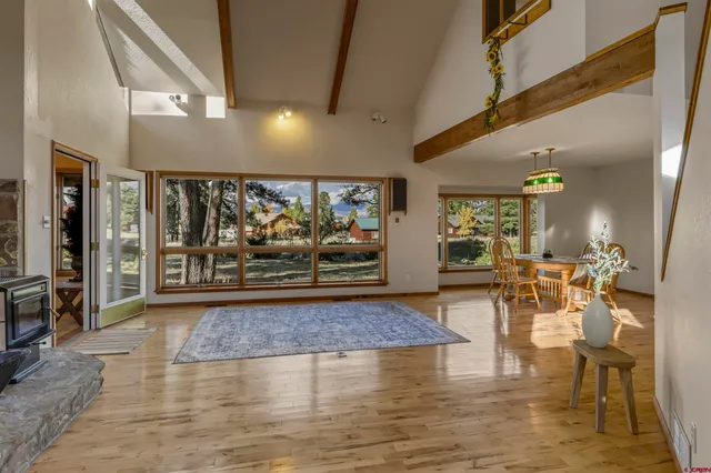 a view of a living room and dining room