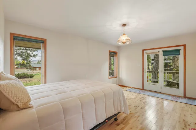a bathroom with double vanity sinks and a mirror
