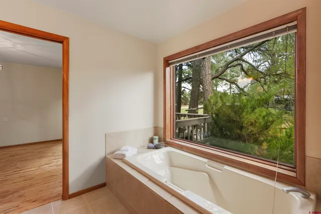 a view of living room with furniture and a mirror