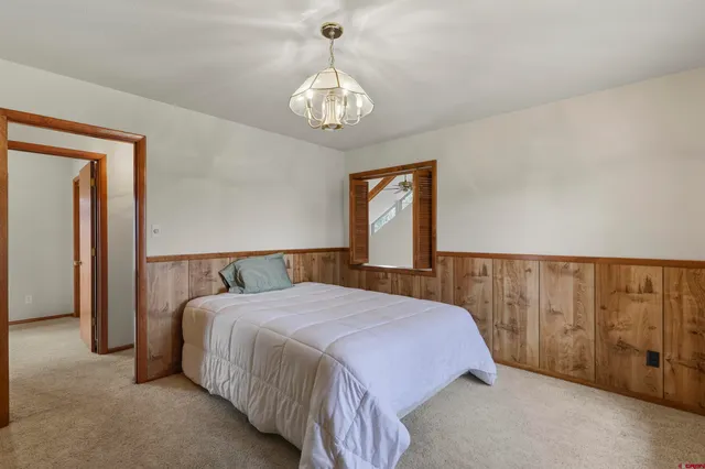 a view of a chandelier in a hallway with a chandelier