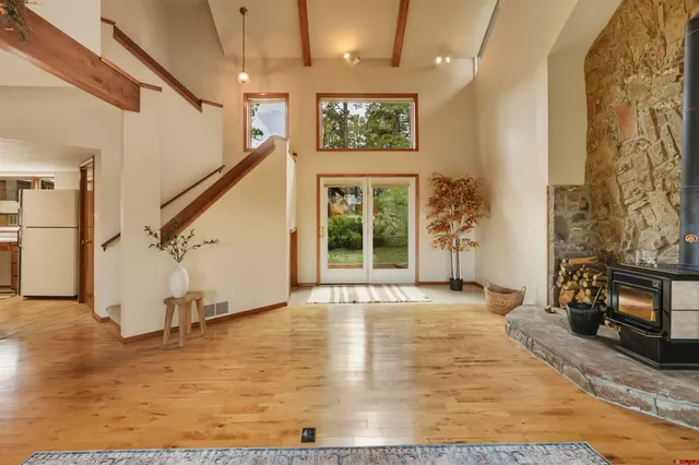 a view of an entryway with wooden floor