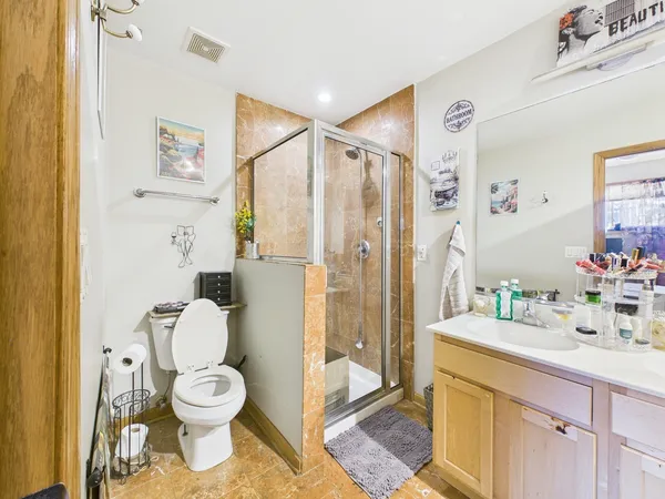 a bathroom with a toilet sink and a shower