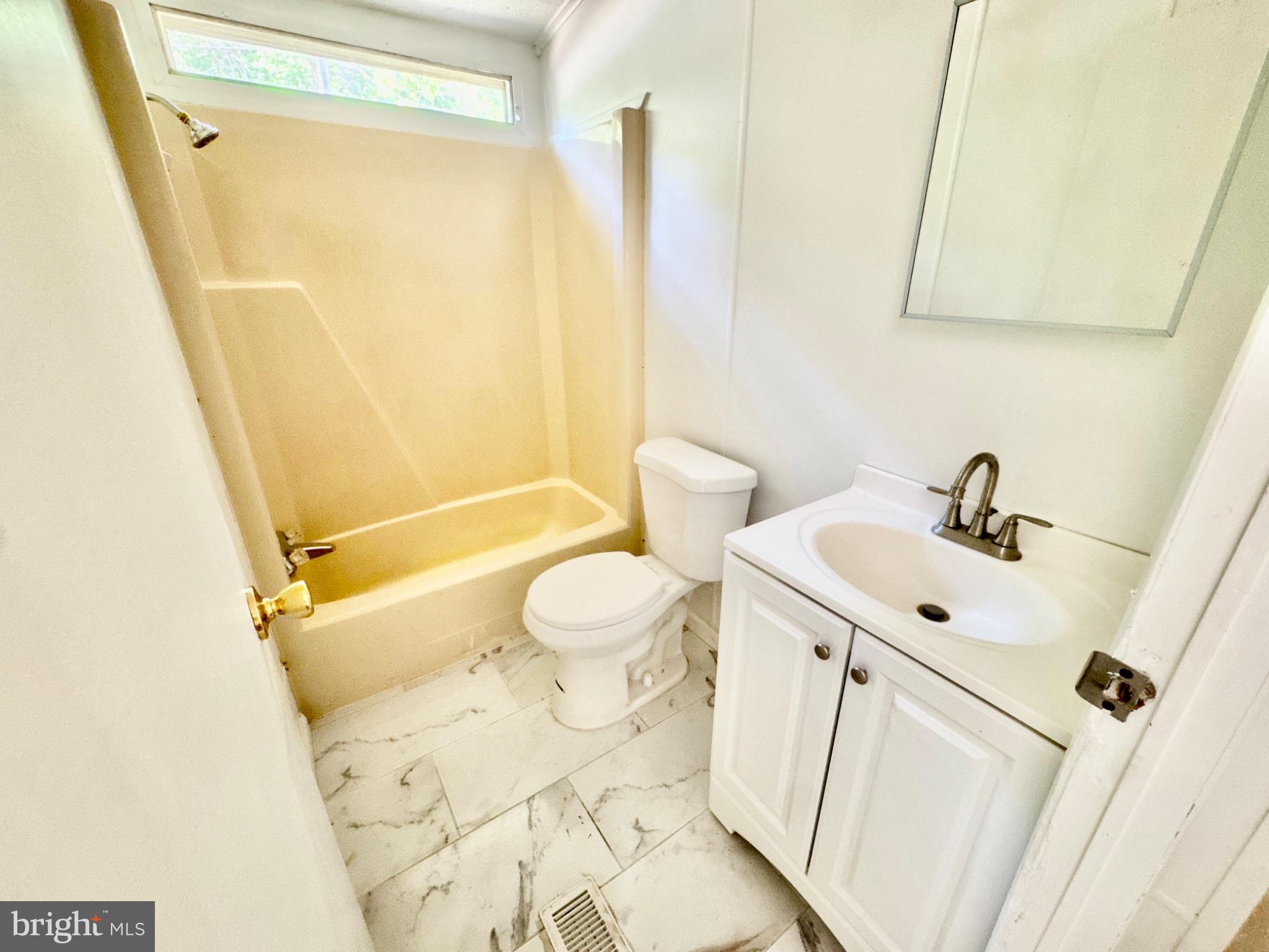 448 Evergreen Road Millville, NJ 08332 - Photo 18 of 25 a bathroom with a sink mirror vanity and toilet