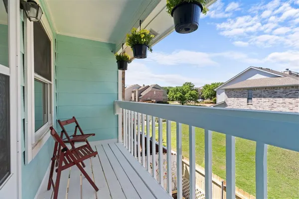 a view of balcony with furniture