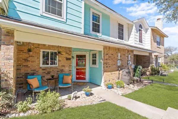 a front view of a building with outdoor seating
