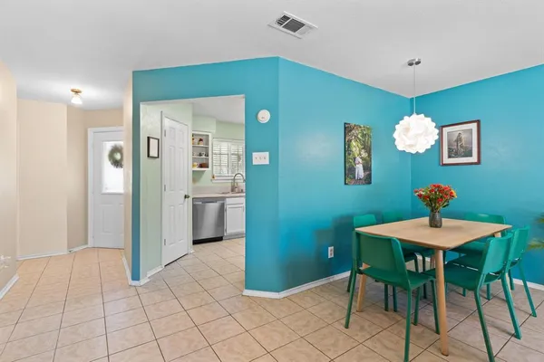 a view of a room with furniture and wooden floor