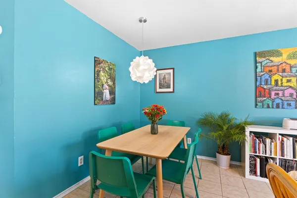 a room with a table and a potted plant