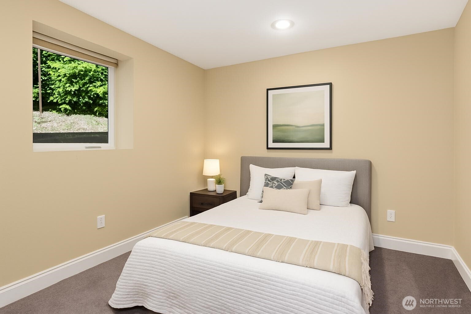 2323 12th Avenue South Seattle, WA 98144 - Photo 23 of 36 a bedroom with a large bed and a lamp