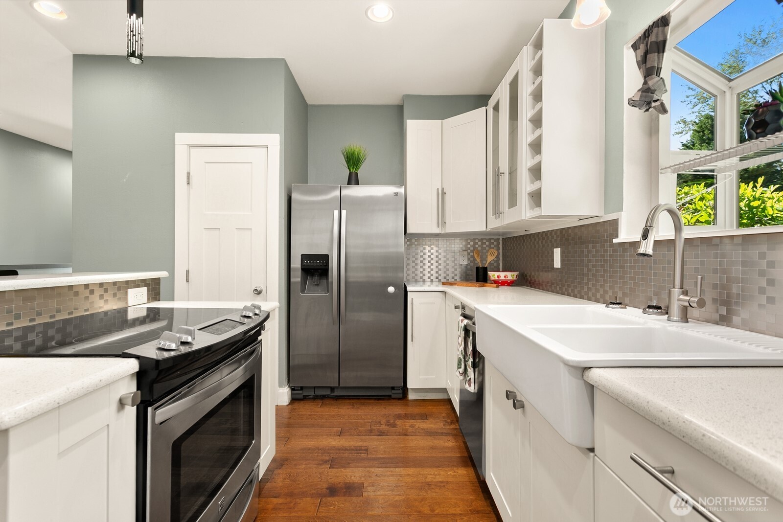 2323 12th Avenue South Seattle, WA 98144 - Photo 9 of 36 a kitchen that has a sink a stove and a refrigerator