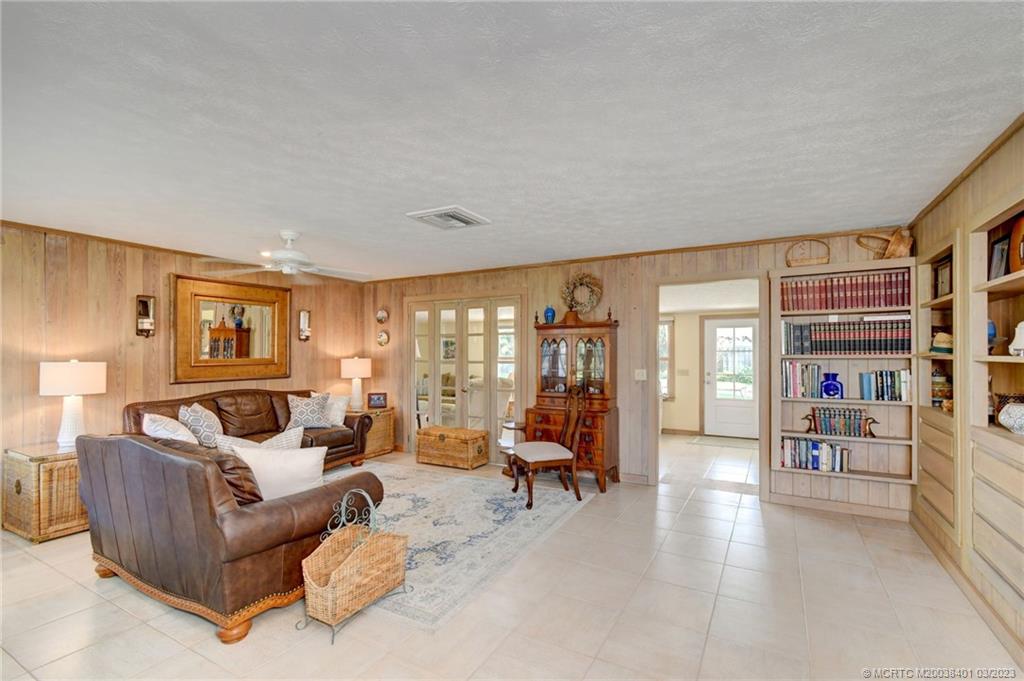 834 Southeast Riverside Drive Stuart, FL 34994 - Photo 11 of 35 Living room with Cedar paneling