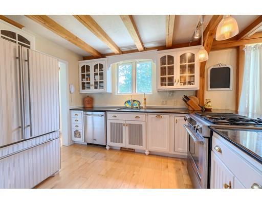 11 Wilder Road Sterling, MA 01564 - Photo 8 of 31 a kitchen with stainless steel appliances granite countertop a stove and a microwave