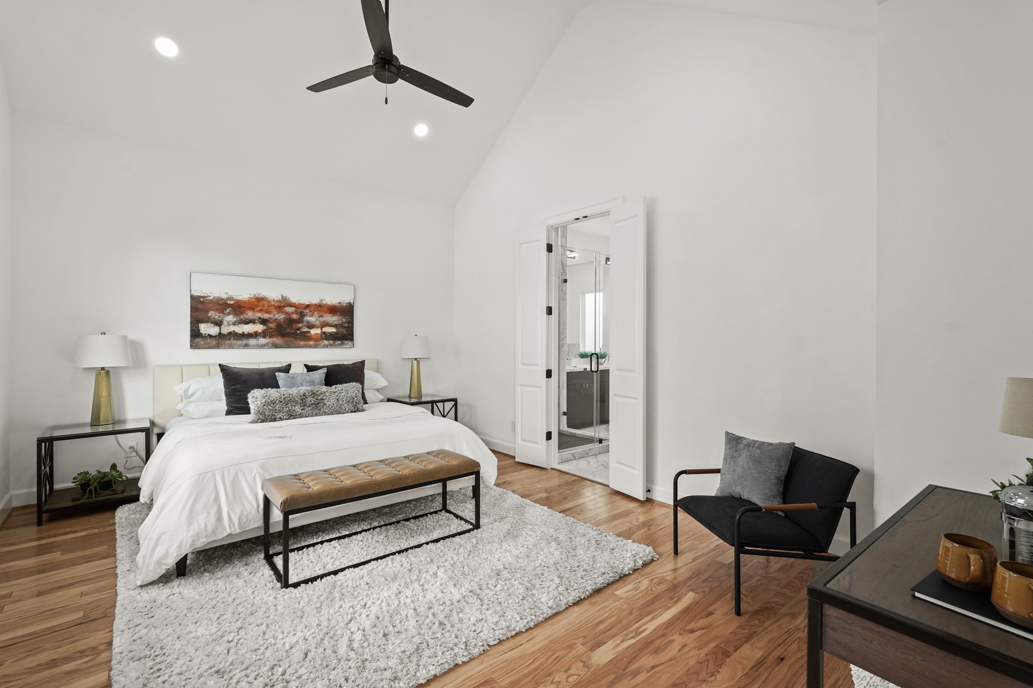 9426 Campbell Road, Unit B Houston, TX 77080 - Photo 20 of 28 a bedroom with a bed and wooden floor