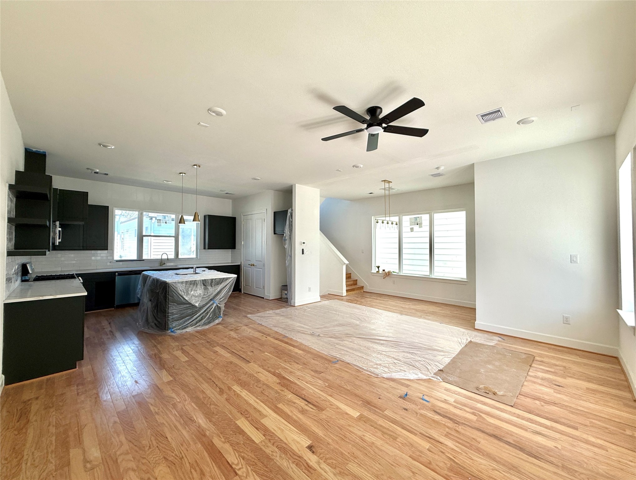 9426 Campbell Road, Unit B Houston, TX 77080 - Photo 4 of 28 a view of a living room a kitchen and a wooden floor