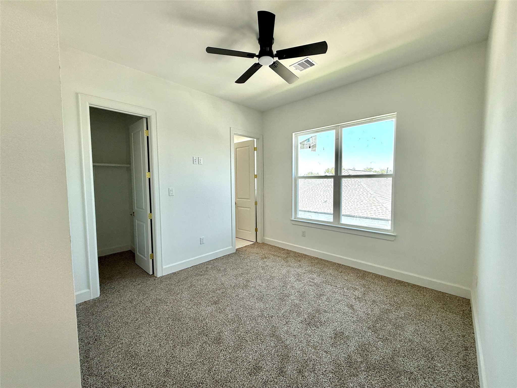9426 Campbell Road, Unit B Houston, TX 77080 - Photo 6 of 28 a view of an empty room with a window