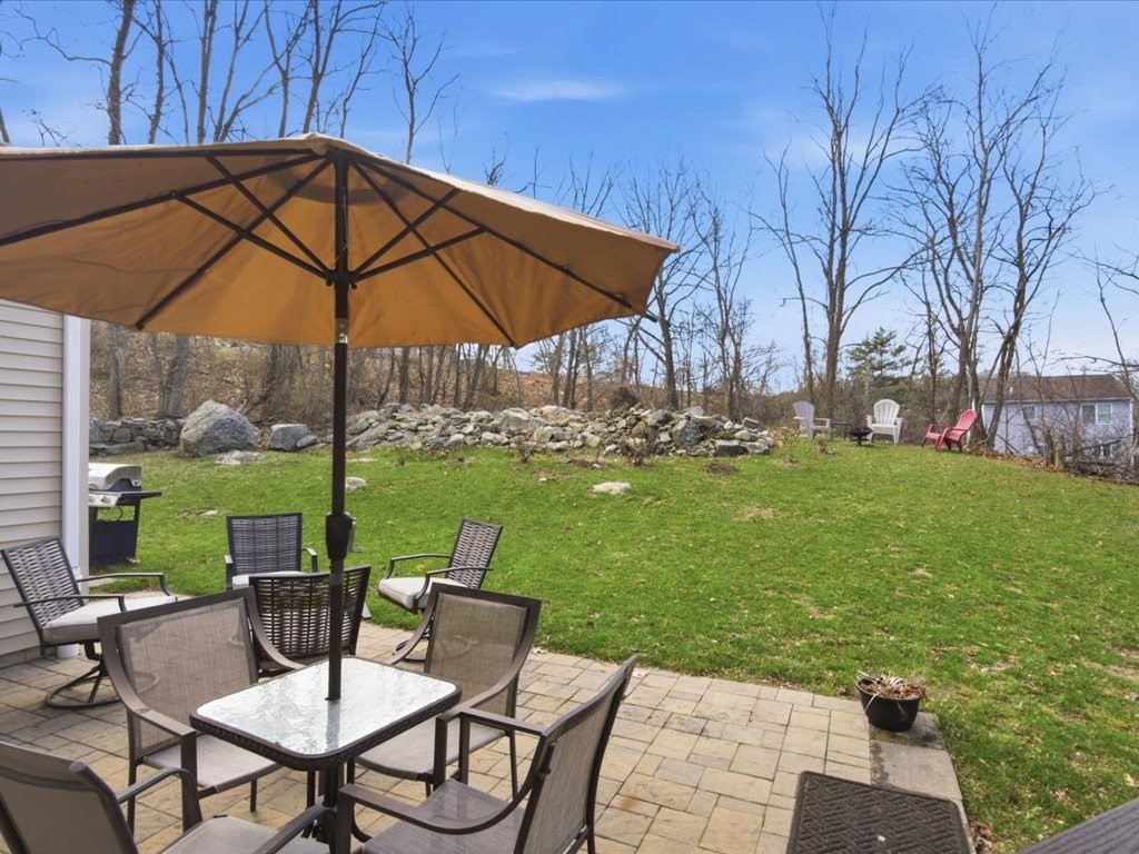67 Ling Street Fall River, MA 02720 - Photo 5 of 32 a view of table and chairs under an umbrella
