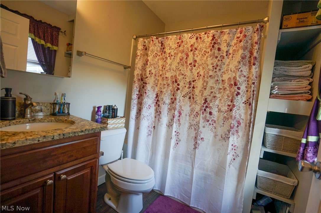1325 County Line Road Hopewell, OH 43746 - Photo 18 of 45 Full bath with vanity and a shower with shower curtain