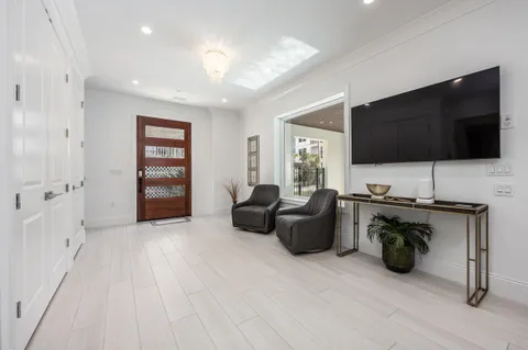 a kitchen with stainless steel appliances white cabinets and a sink
