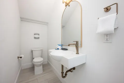 a bedroom with a bed and flat screen tv