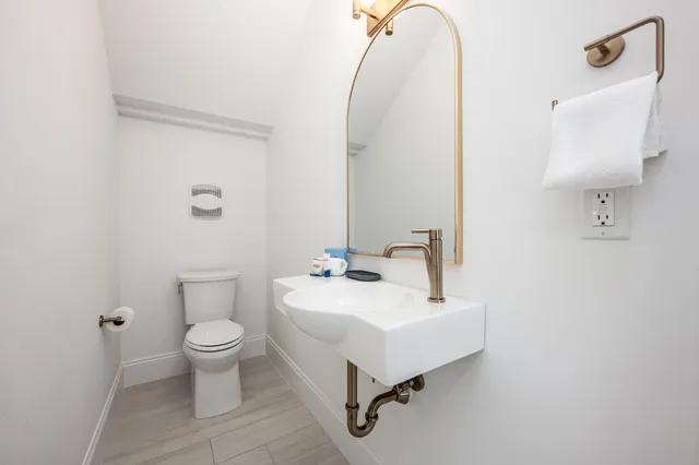 a bedroom with a bed and flat screen tv