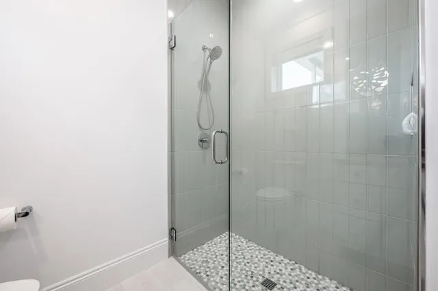 a dining room with furniture and a window