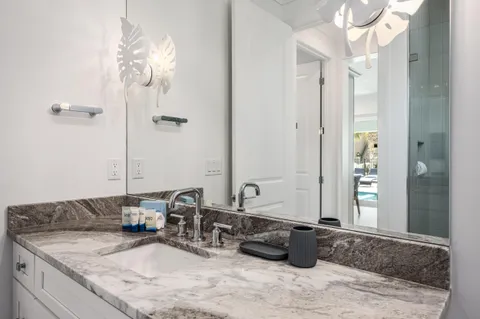 a kitchen with granite countertop appliances cabinets and a sink