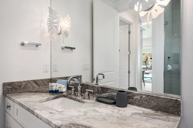 a kitchen with granite countertop appliances cabinets and a sink