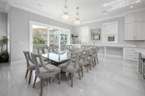 a utility room with cabinets washer and dryer