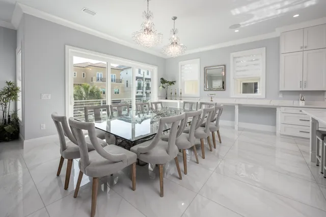 a utility room with cabinets washer and dryer