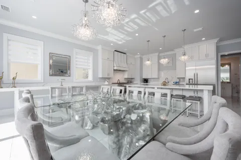 a white tub sitting in a room next to a window