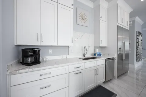 a bathroom with a shower sink vanity and mirror