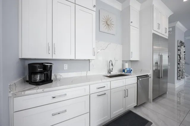 a bathroom with a shower sink vanity and mirror