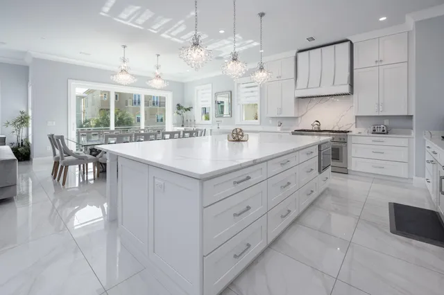 a white toilet sitting next to a bathroom sink