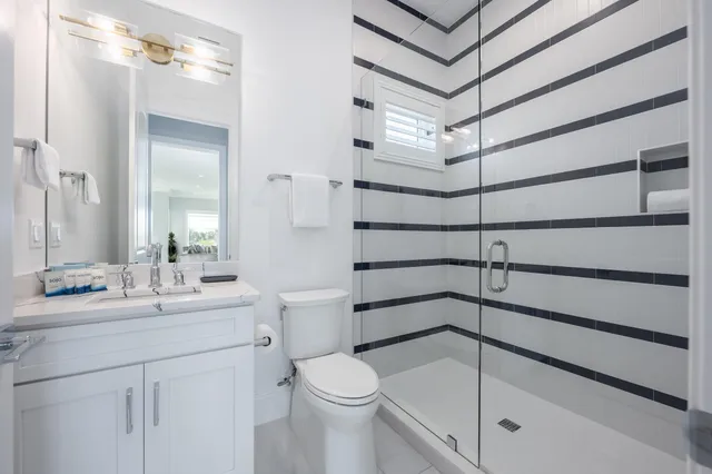 a bedroom with a bed and flat screen tv