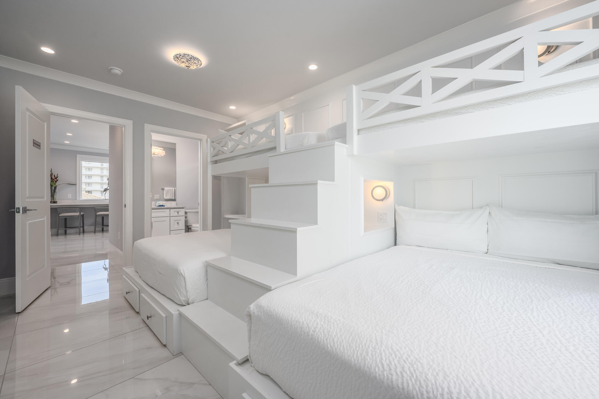 244 Open Gulf Street Miramar Beach, FL 32550 - Photo 68 of 151 a bedroom with a large bed and a chandelier