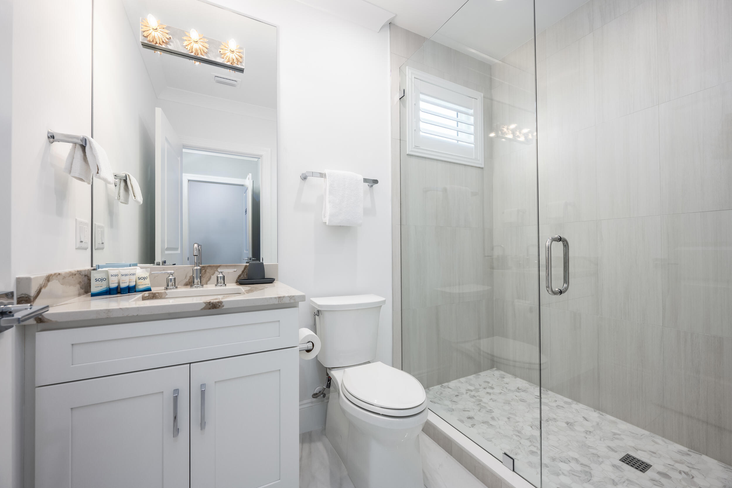 244 Open Gulf Street Miramar Beach, FL 32550 - Photo 75 of 151 a bathroom with a sink toilet vanity and shower