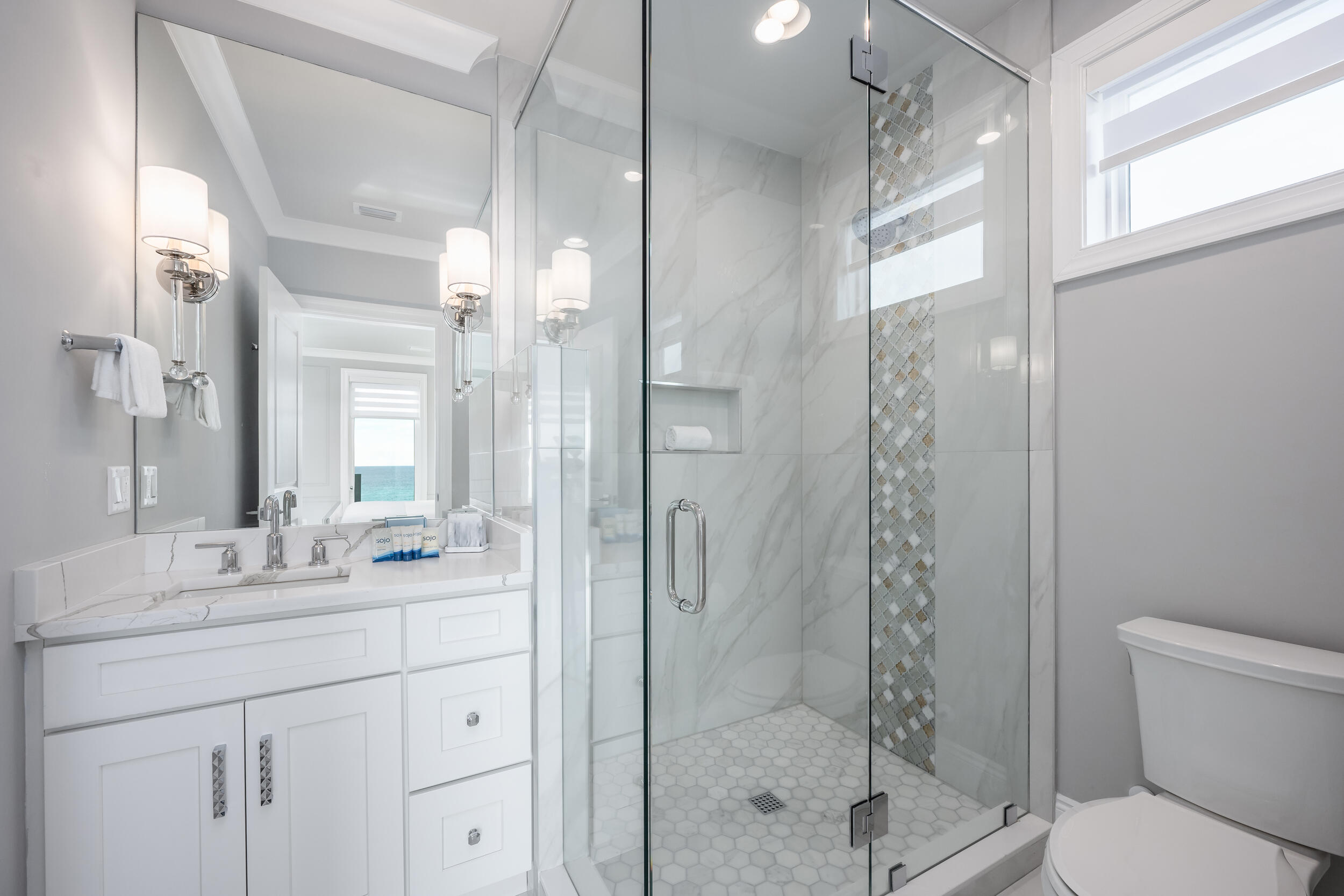 244 Open Gulf Street Miramar Beach, FL 32550 - Photo 86 of 151 a bathroom with a shower sink vanity and mirror