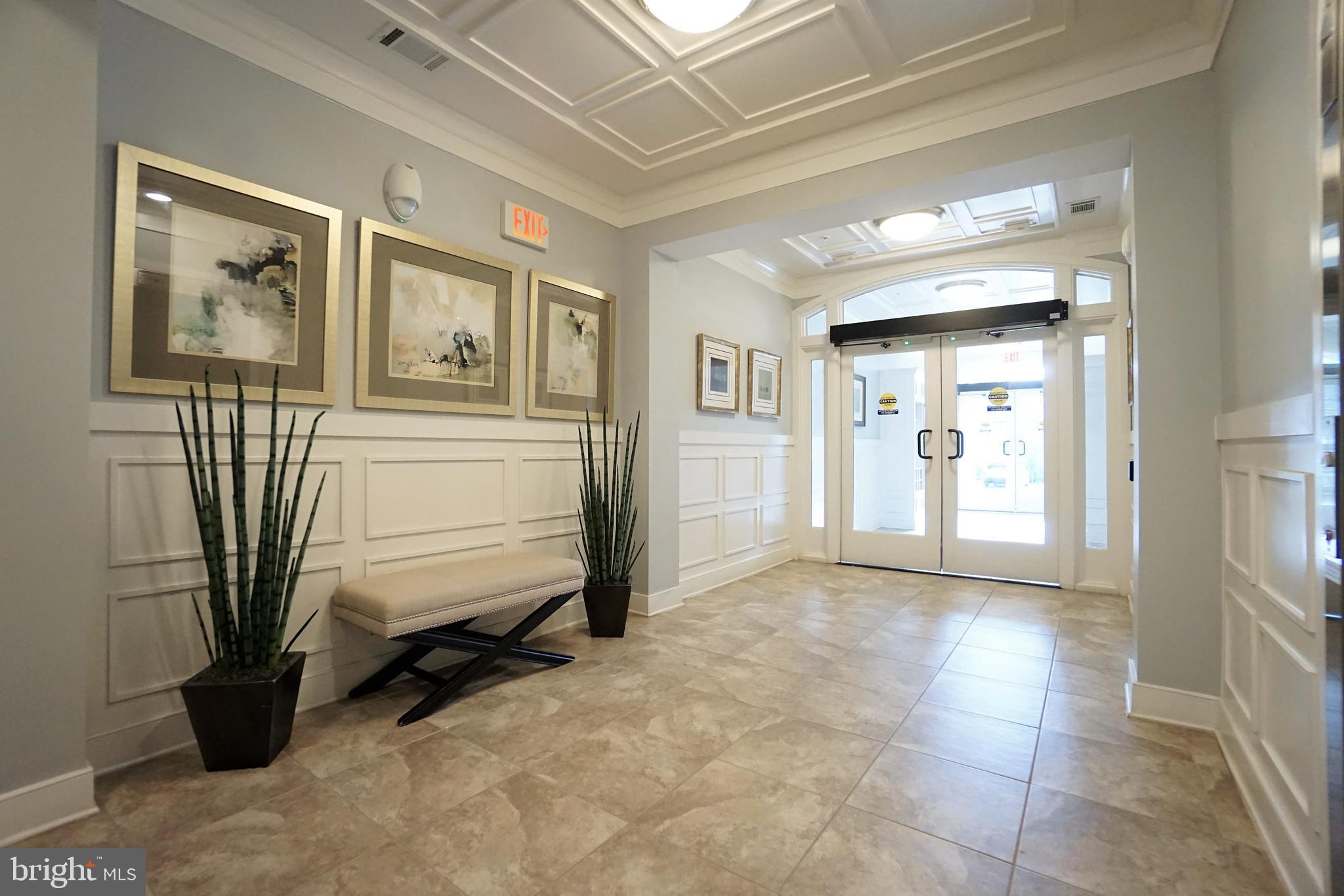 20600 Hope Spring Terrace, Unit 301 Ashburn, VA 20147 - Photo 2 of 33 Complex Foyer.