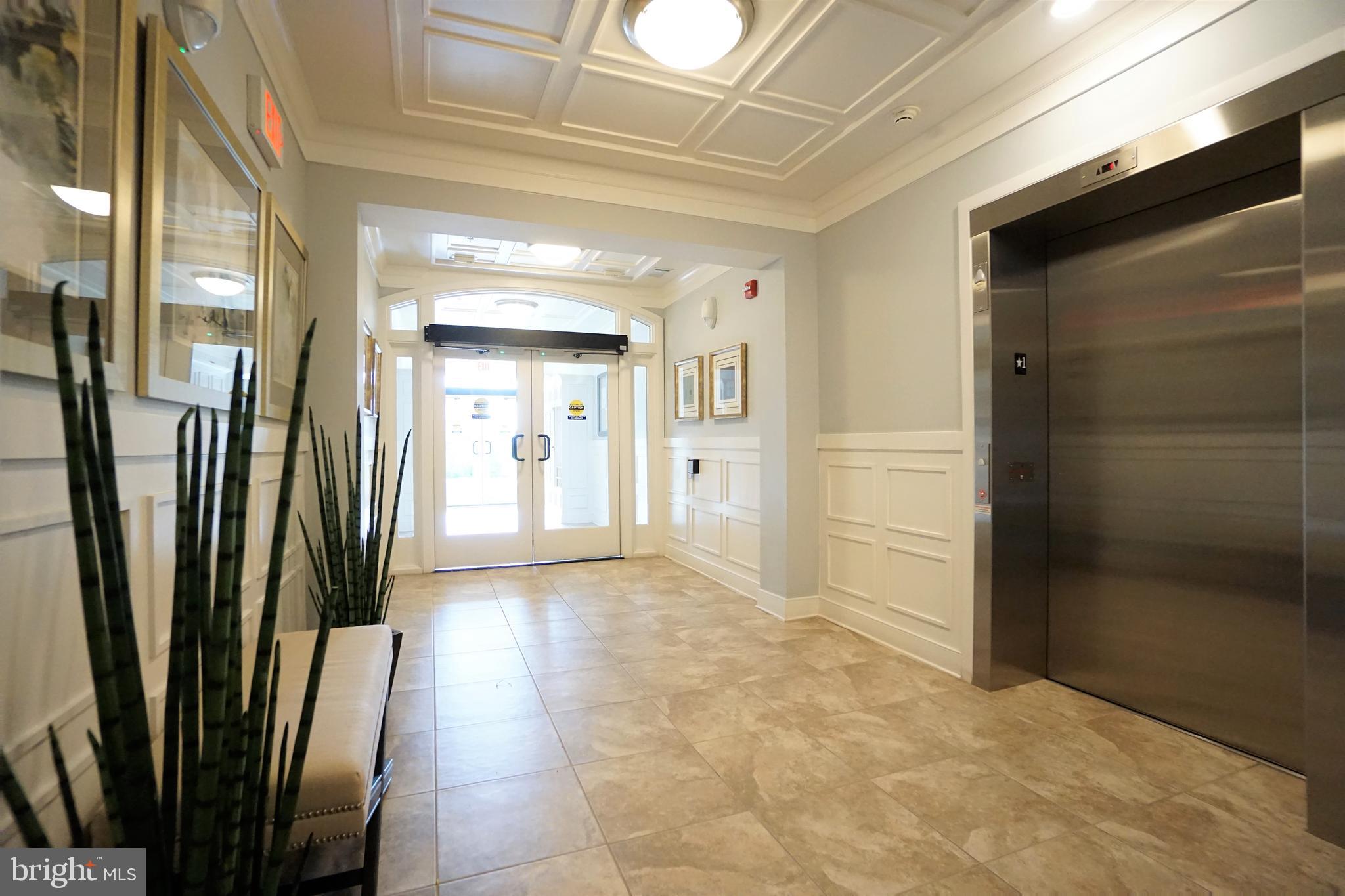 20600 Hope Spring Terrace, Unit 301 Ashburn, VA 20147 - Photo 3 of 33 Complex Foyer.