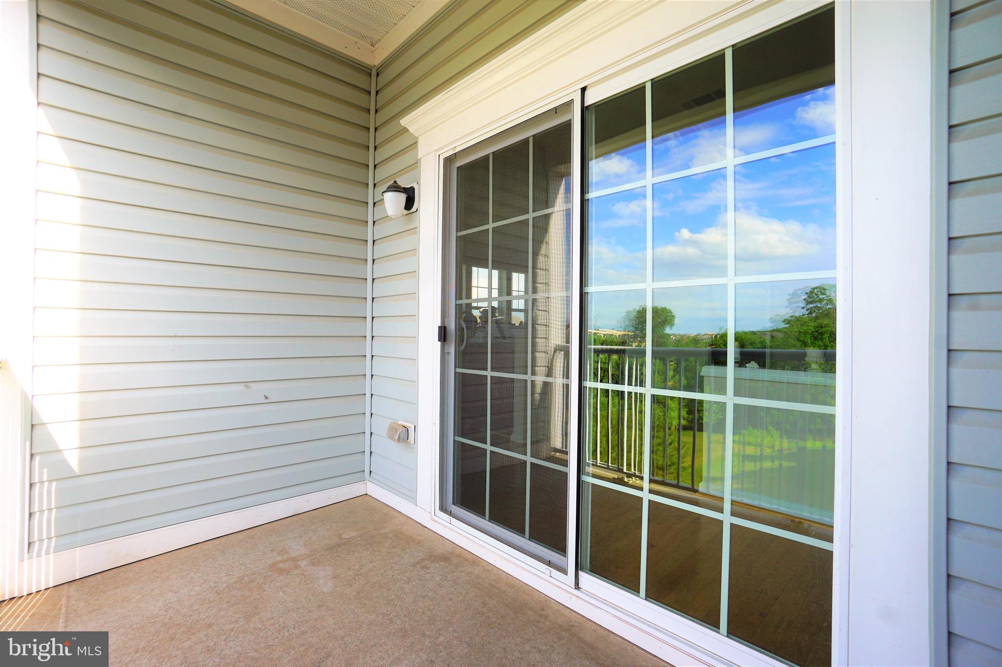 20600 Hope Spring Terrace, Unit 301 Ashburn, VA 20147 - Photo 28 of 33 Patio.