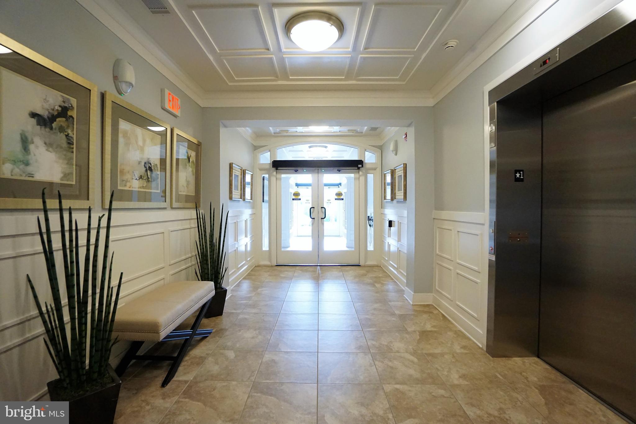 20600 Hope Spring Terrace, Unit 301 Ashburn, VA 20147 - Photo 4 of 33 Complex Foyer.